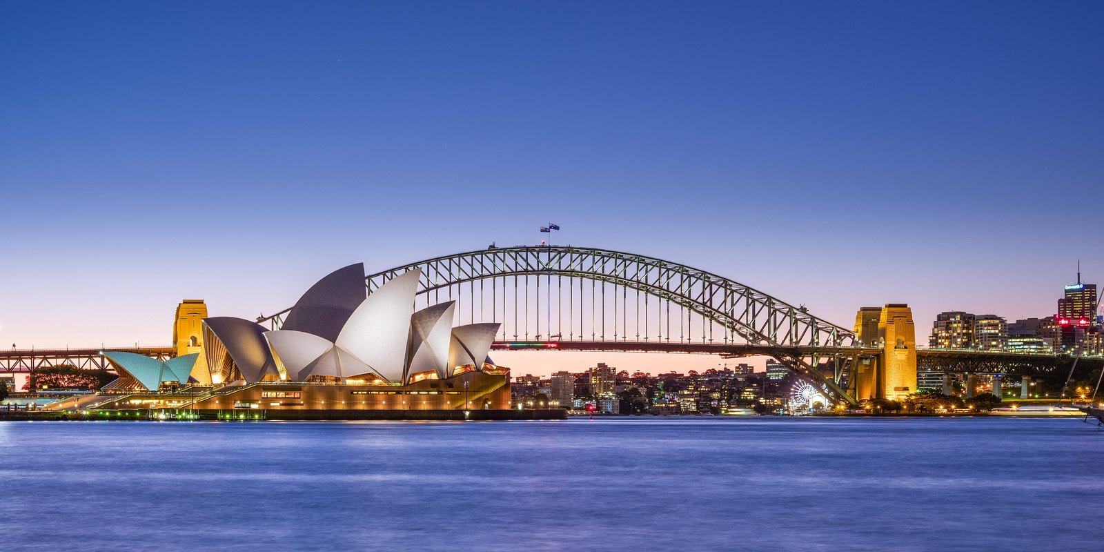 Sydney skyline at dusk: Opera House and Harbour Bridge